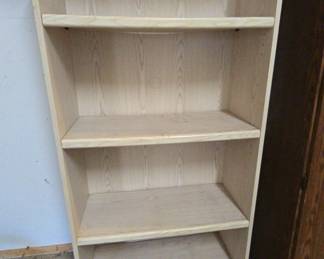 Tall Light Color Bookcase That Is Perfect In The Garage