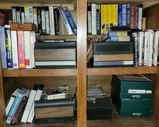 205 - Cabinet Lot Cassettes, VHS Tapes, and More