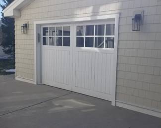 Insulated garage door is 9' x 7'; exterior light fixtures