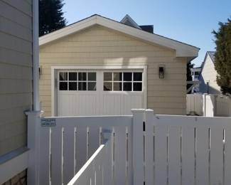 Vinyl fencing; 9' x 7' garage door
