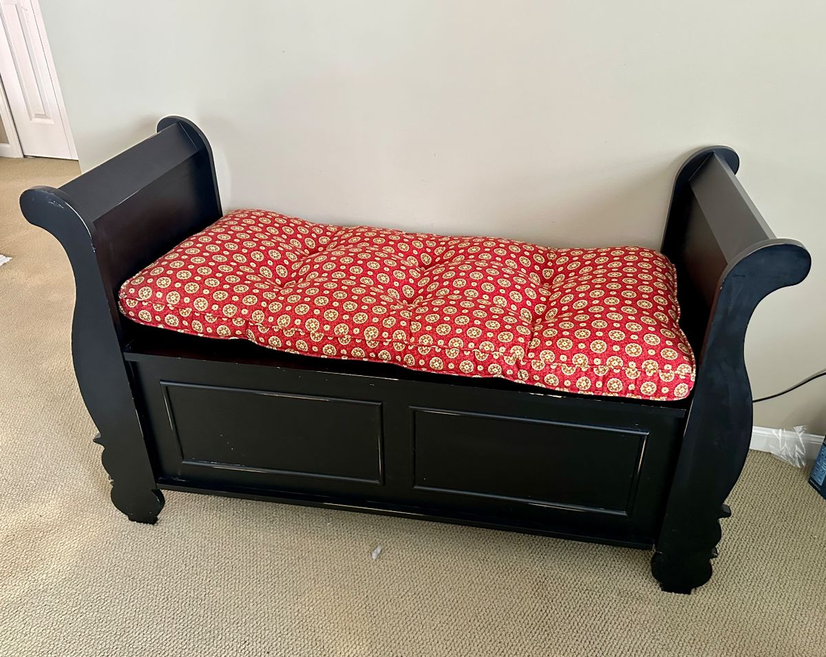 Sleigh style bench with hide away storage and cushion