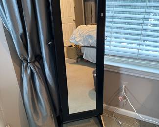 Standing mirror with jewelry storage