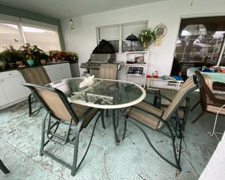 Lanai table and up to 6 adjustable chairs and 2 matching ottomans