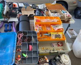 3 different containers full of fishing supplies 