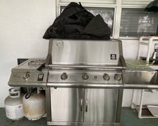 Huge grill plus cover and extra propane tank 