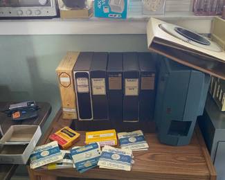 Slide projector and many slides of many different states and countries