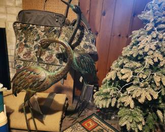 flocked Christmas tree and garden herons