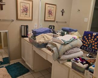 Towels, rugs, bathroom supplies, etc