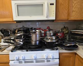 Nice selection of pots and pans ... all shapes and sizes! Iron skillets, too
