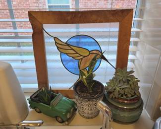 a selection of succulents + a beautiful stained-glass hummingbird