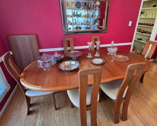 Teak dining set by Ansager Mobler of Denmark. Comes with 6 chairs and 2 leaves. Beautiful wood and design. Just look at those chairs ... classic Danish modern!