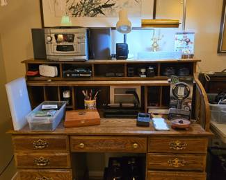 roll top desk, stereo, office supplies, chrome lamp