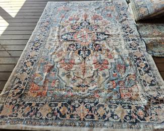 There are 3 of these beautiful rugs, thy appear to be new!