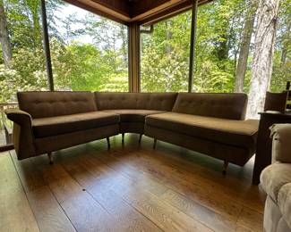 MCM sectional sofa that has been reupholstered, still on brand though