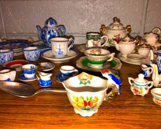 Tiny porcelain cup with parrot on the handle