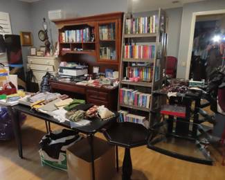 Hardback and paperbacks, office supplies, ladder bookcase. HP photo printer, tv stand, clutch purses, office supplies.