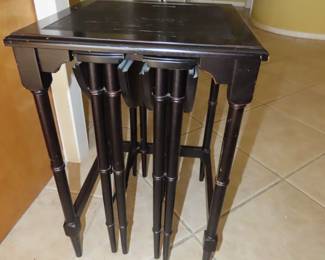 Black end table with two pullout folding tables.