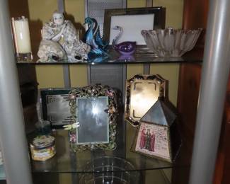 Glass figures, Lenox frames, candles, New York City snow globe.