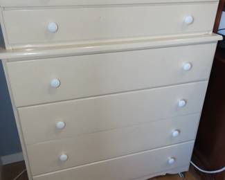 Seven drawer white chest with castors.