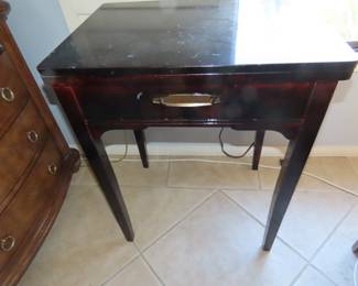 Vintage Singer sewing machine in cabinet.