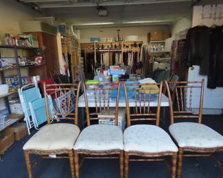 4 faux bamboo dining chairs, shelves of cleaning supplies, cabinets of clothing and shoes.