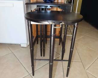 Black end table with two pullout folding tables.