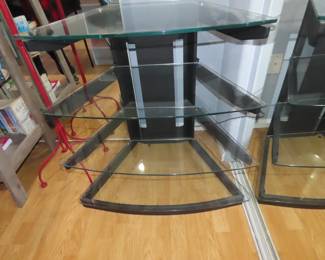 TV media stand with heavy glass shelves.