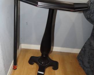 Black pedestal table.