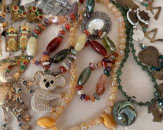 Natural stone necklaces, pins, and funky earrings