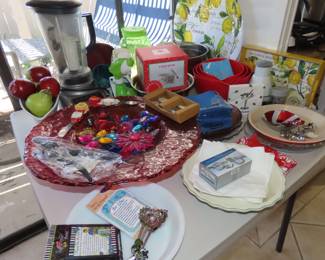 itchenAid blender, Salad Shredder, large decorative red glass dish with sun catchers, pie plates, new flatware and measuring spoons.