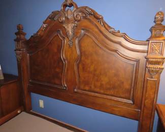 Solid wood carved queen size bed frame with head and foot boards.