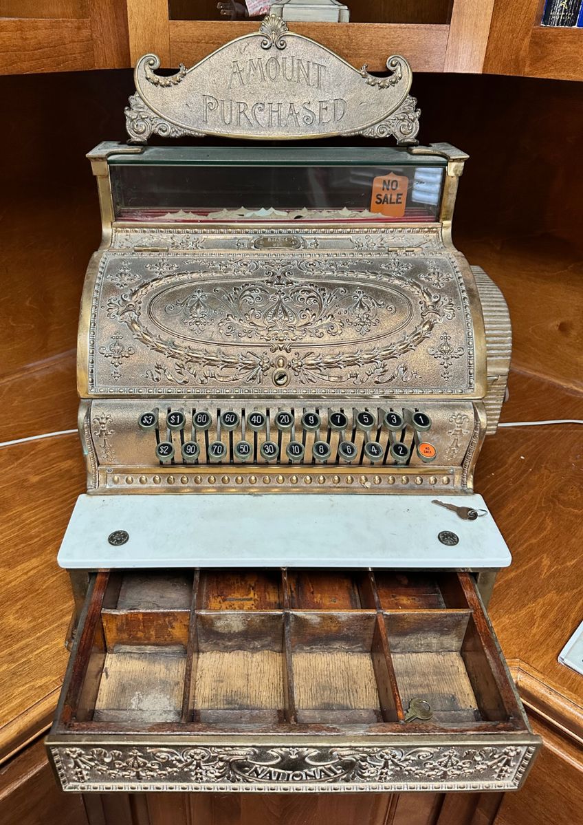 Brass cash register made by National Cash Register (NCR), ca 1910.  Includes key.
