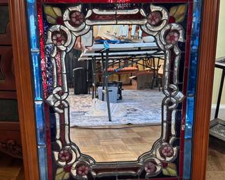 Framed stained glass mirror.