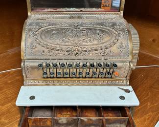 Brass cash register made by National Cash Register (NCR), ca 1910.  Includes key.