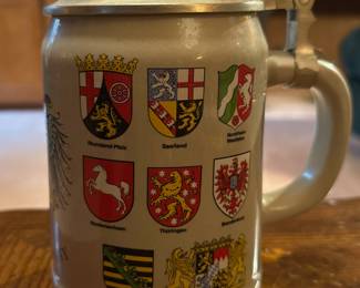 Old German beer stein with pewter lid.