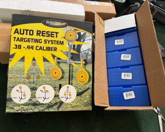 Auto reset targeting system and empty amo cases 