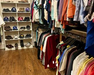 LARGE MASTER CLOSET FULL OF WOMEN'S AND MEN'S CLOTHING AND SHOES.