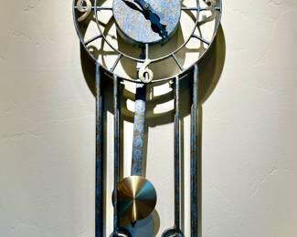 SLIGH MODERN INDUSTRIAL LOOK WALL CLOCK WITH PENDULUM.  IT WORKS!  RETAILS FOR OVER $500.
