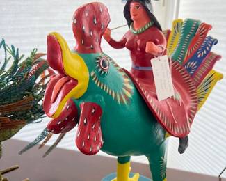 It's a "Chicken" girl riding a rooster!