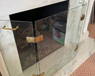 glass and brass fireplace screen