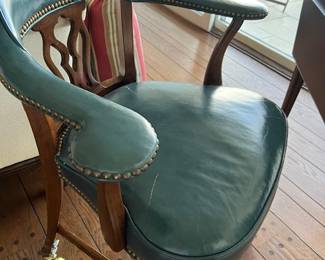 Green leather rolling desk chair