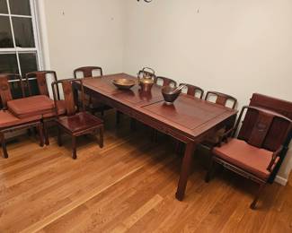 Dining room table w/9 chairs plus 2 leaves and pads.  Hong Kong (Shown with one leaf in) 