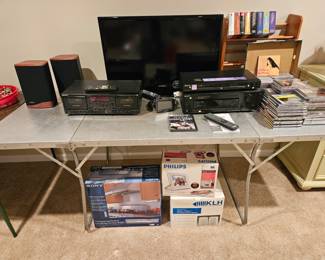Samsung 33" TV; Sony CD/DVD player, receiver, cassette player and Adven speakers. Also KLH speakers new in box on floor