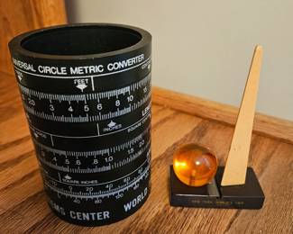 Many collectables at this sale. These are just two close up's .. World Trade Metric  and N.Y. World's Fair pencil sharpener
