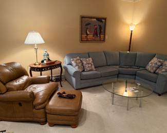Hancock & Moore Leather Chair and Ottoman, Brass and Glass Table Lamp, Vintage Teal Sectional. MCM Chrome and Glass Cocktail Table, Carved Wood Inlay Table
