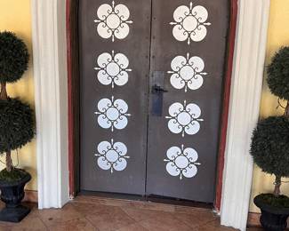 Topiaries, to the left & right of the grand original Hollywood doors.