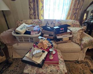 A bunch of costume jewlery yet to be unpacked. Hat pins and more.