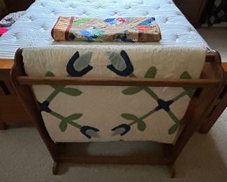 Beautiful quilts and quilt rack. 