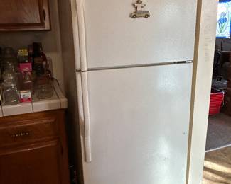 Compact refrigerator. Perfect for small spaces, garage, etc. Clean and ice cold. 
