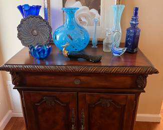 1 of 2 small consoles/caninets. Lots of cobalt glass!